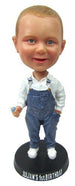Child in Denim Overalls